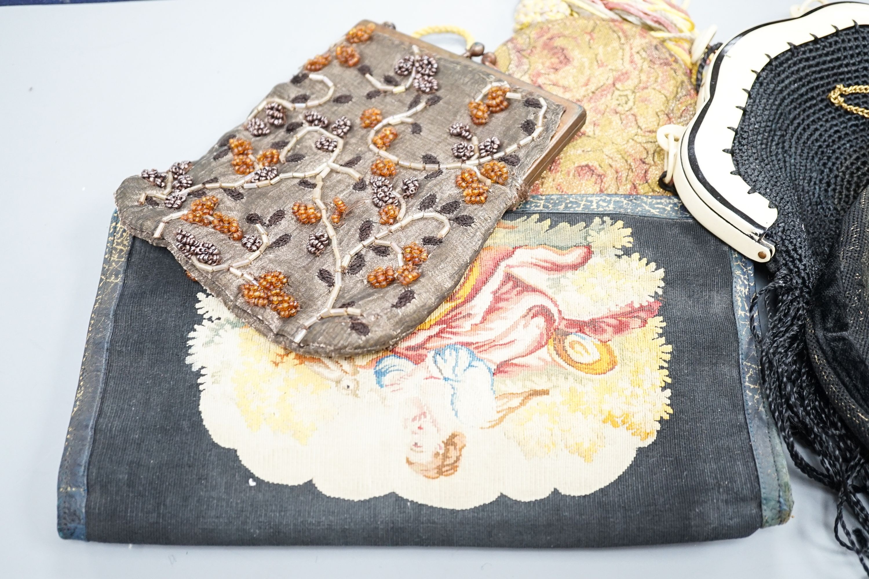 A fine tapestry clutch bag together with a collection of beaded petit point and lurex evening bags (7)